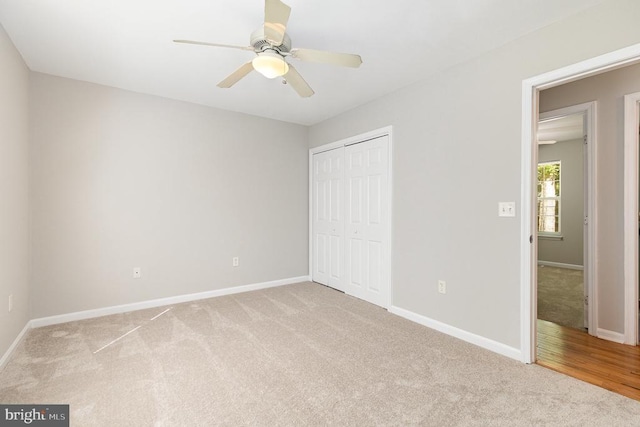 7001 Aspen Ln, Spotsylvania, VA 22551 - unfurnished bedroom featuring light carpet, a closet, baseboards, and a ceiling fan