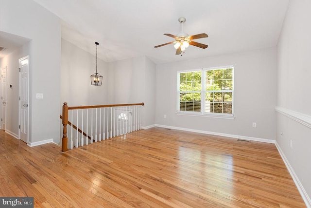 7001 Aspen Ln, Spotsylvania, VA 22551 - unfurnished room featuring light wood-type flooring, a ceiling fan, baseboards, and vaulted ceiling