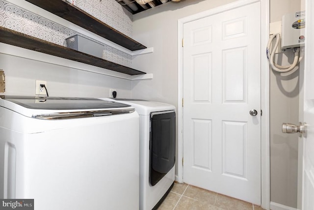 7001 Aspen Ln, Spotsylvania, VA 22551 - washroom with washer and clothes dryer and light tile patterned floors