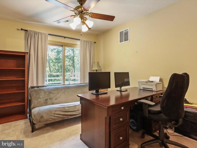  - home office with a ceiling fan and light colored carpet