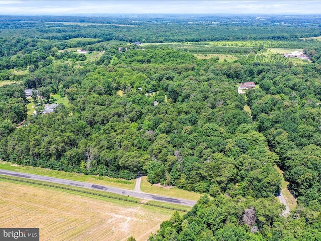  - aerial view of property and surrounding area with a forest
