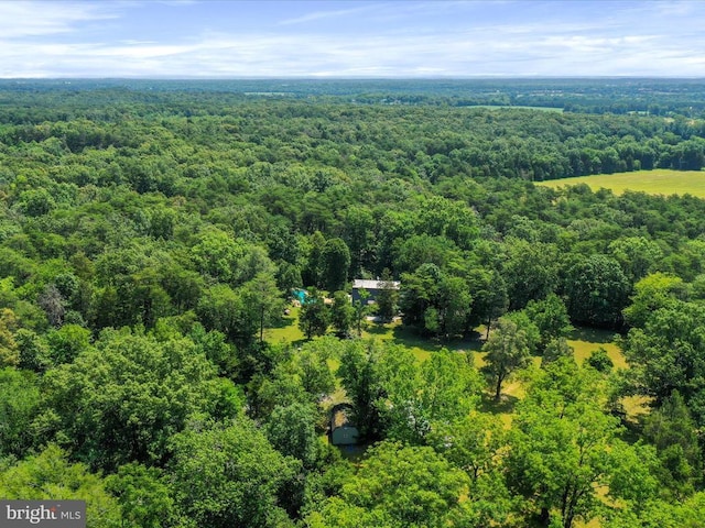  - drone / aerial view of a heavily wooded area