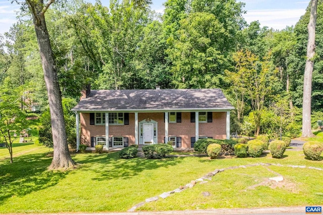 411 Westmoreland Ct, Charlottesville, VA 22901 - split foyer home featuring brick siding, a front yard, a chimney, and roof with shingles