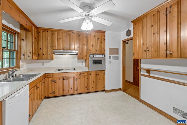 411 Westmoreland Ct, Charlottesville, VA 22901 - kitchen with white appliances, under cabinet range hood, light countertops, a ceiling fan, and brown cabinets