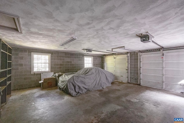 411 Westmoreland Ct, Charlottesville, VA 22901 - garage with concrete block wall and a garage door opener