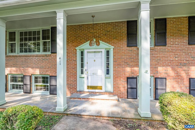 411 Westmoreland Ct, Charlottesville, VA 22901 - view of exterior entry featuring brick siding