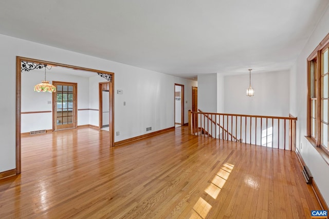 411 Westmoreland Ct, Charlottesville, VA 22901 - unfurnished room with light wood-style flooring and a chandelier