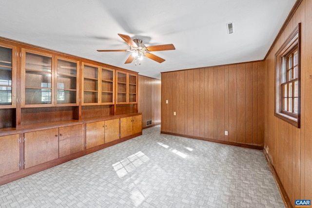 411 Westmoreland Ct, Charlottesville, VA 22901 - unfurnished room featuring a ceiling fan and wooden walls