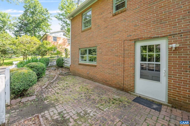 411 Westmoreland Ct, Charlottesville, VA 22901 - view of side of home featuring brick siding and a patio