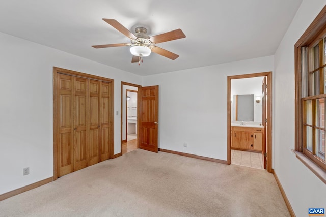 411 Westmoreland Ct, Charlottesville, VA 22901 - unfurnished bedroom featuring light colored carpet, a closet, ensuite bath, and ceiling fan
