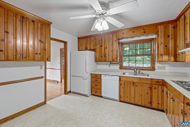 411 Westmoreland Ct, Charlottesville, VA 22901 - kitchen featuring white appliances, light countertops, brown cabinets, and light floors