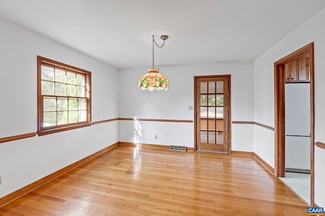 411 Westmoreland Ct, Charlottesville, VA 22901 - spare room with light wood-style floors and baseboards