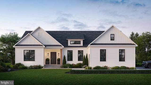  - modern farmhouse style home with a front lawn, board and batten siding, and a standing seam roof