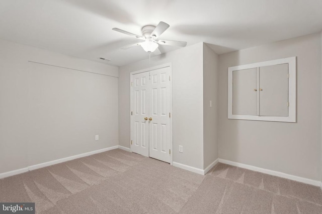 10800 Gordon Rd, Spotsylvania, VA 22553 - unfurnished bedroom with carpet flooring, baseboards, a closet, and a ceiling fan