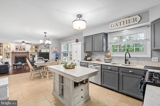 4924 Queensbury Cir, Fredericksburg, VA 22408 - kitchen featuring stainless steel dishwasher, gray cabinetry, light countertops, and black range with gas cooktop