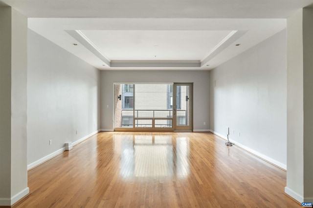 112 5th St SE Unit 3D, Charlottesville, VA 22902 - unfurnished room featuring a raised ceiling and wood finished floors