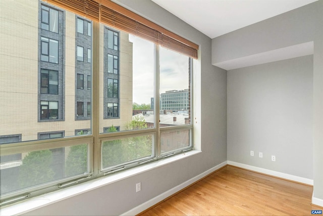 112 5th St SE Unit 3D, Charlottesville, VA 22902 - unfurnished room featuring baseboards and wood finished floors