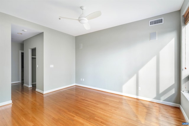 112 5th St SE Unit 3D, Charlottesville, VA 22902 - spare room featuring light wood-style floors and a ceiling fan