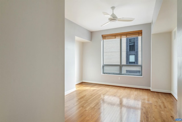 112 5th St SE Unit 3D, Charlottesville, VA 22902 - spare room featuring light wood-style floors and ceiling fan