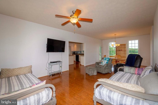 7204 Morris Rd, Spotsylvania, VA 22551 - living area featuring light wood-style floors, a chandelier, a ceiling fan, and baseboards