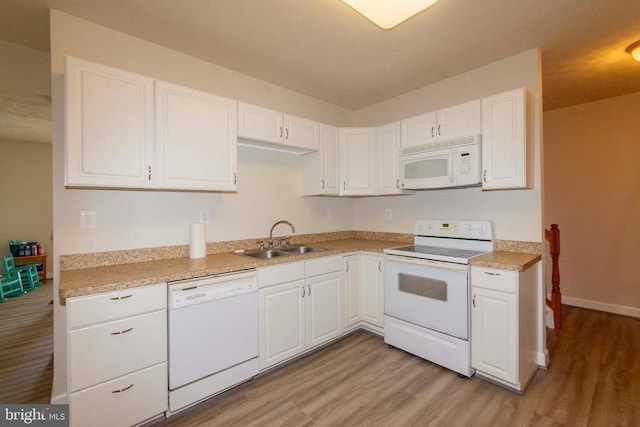 7204 Morris Rd, Spotsylvania, VA 22551 - kitchen with white appliances, a sink, light wood-style flooring, white cabinetry, and light countertops