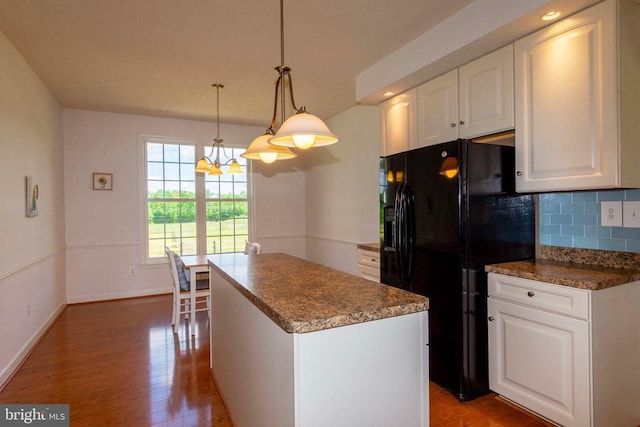 7204 Morris Rd, Spotsylvania, VA 22551 - kitchen featuring black refrigerator with ice dispenser, light wood-type flooring, decorative backsplash, white cabinetry, and a center island
