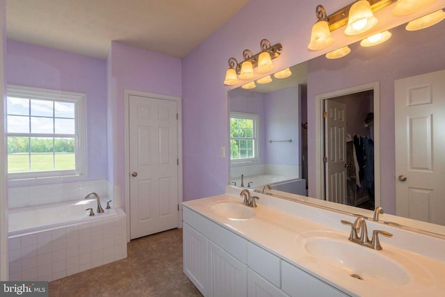 7204 Morris Rd, Spotsylvania, VA 22551 - full bath featuring healthy amount of natural light, double vanity, a garden tub, and tile patterned floors