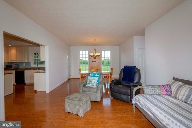 7204 Morris Rd, Spotsylvania, VA 22551 - living area featuring light wood-style flooring, a chandelier, and baseboards