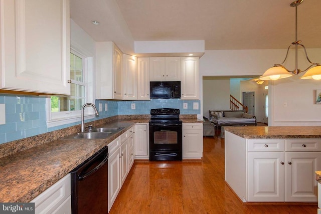7204 Morris Rd, Spotsylvania, VA 22551 - kitchen with black appliances, a sink, white cabinets, and light wood-type flooring
