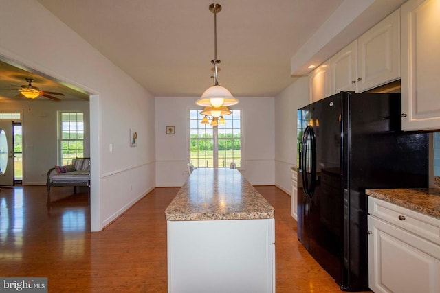 7204 Morris Rd, Spotsylvania, VA 22551 - kitchen with freestanding refrigerator, a kitchen island, healthy amount of natural light, and white cabinetry