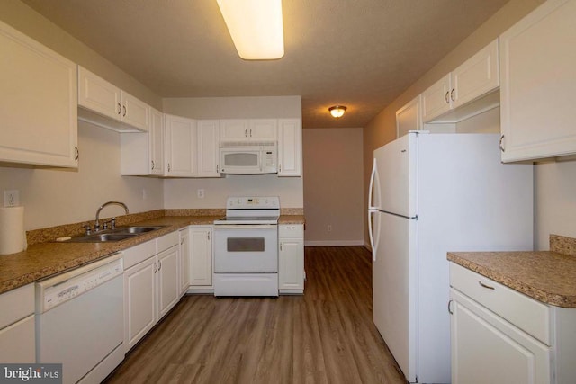 7204 Morris Rd, Spotsylvania, VA 22551 - kitchen with white appliances, a sink, dark wood-type flooring, and white cabinetry