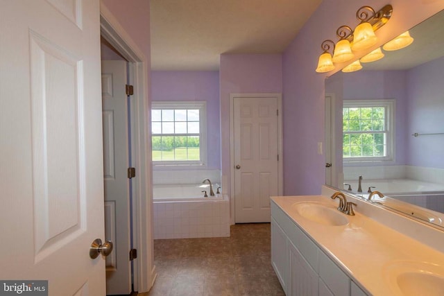 7204 Morris Rd, Spotsylvania, VA 22551 - full bathroom with plenty of natural light, a bath, double vanity, and tile patterned flooring