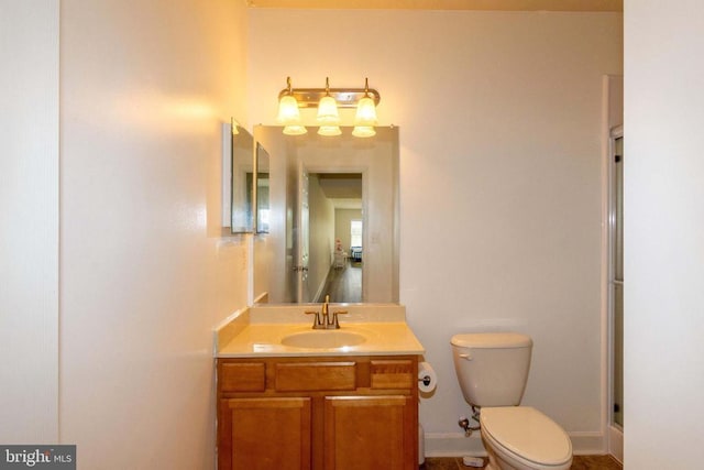7204 Morris Rd, Spotsylvania, VA 22551 - full bathroom with toilet, vanity, baseboards, and a shower with shower door