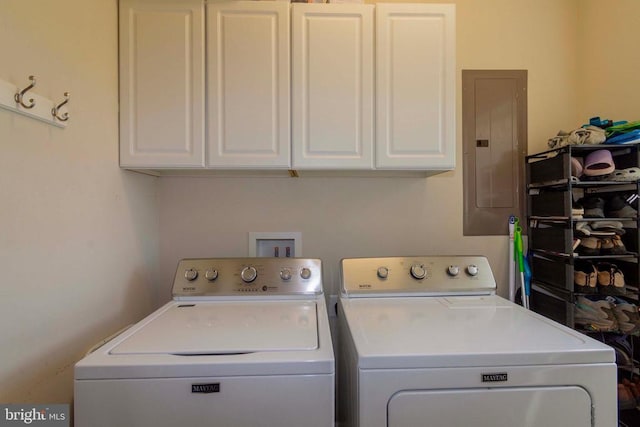 7204 Morris Rd, Spotsylvania, VA 22551 - laundry area featuring electric panel, washing machine and clothes dryer, and cabinet space
