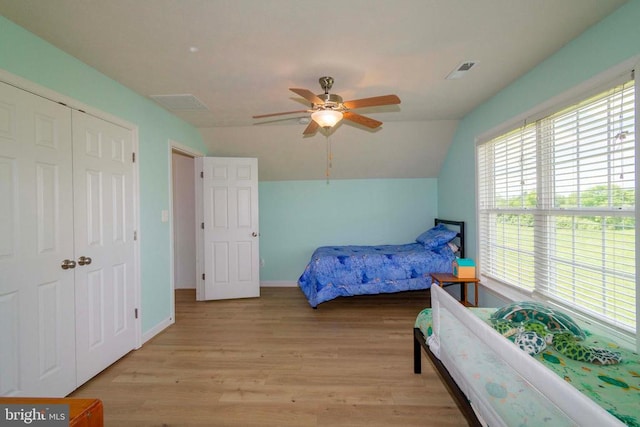 7204 Morris Rd, Spotsylvania, VA 22551 - bedroom with light wood-type flooring, vaulted ceiling, a closet, a ceiling fan, and baseboards
