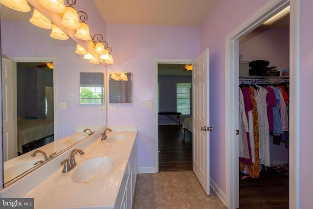 7204 Morris Rd, Spotsylvania, VA 22551 - ensuite bathroom featuring ceiling fan, double vanity, plenty of natural light, and a chandelier