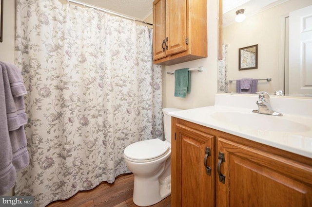bathroom featuring wood finished floors, toilet, vanity, and a shower with shower curtain