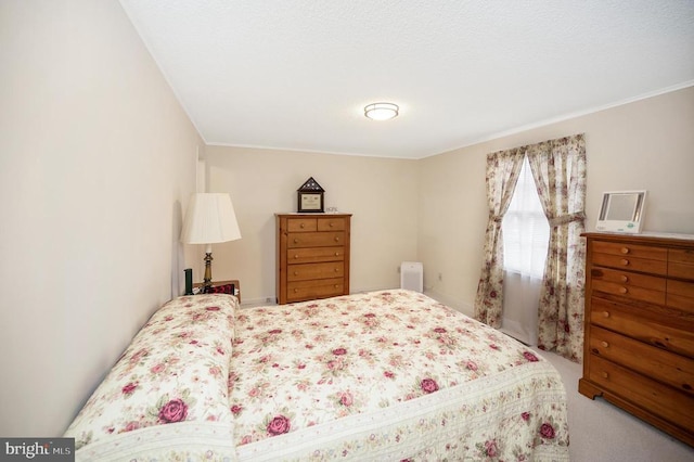 bedroom with carpet flooring and ornamental molding