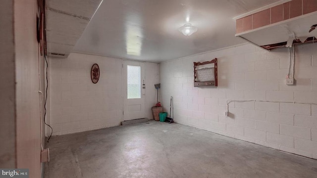 909 Mill Creek Rd, Luray, VA 22835 - entrance foyer with unfinished concrete flooring and concrete block wall