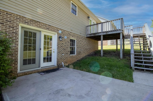 view of patio featuring stairs and a deck