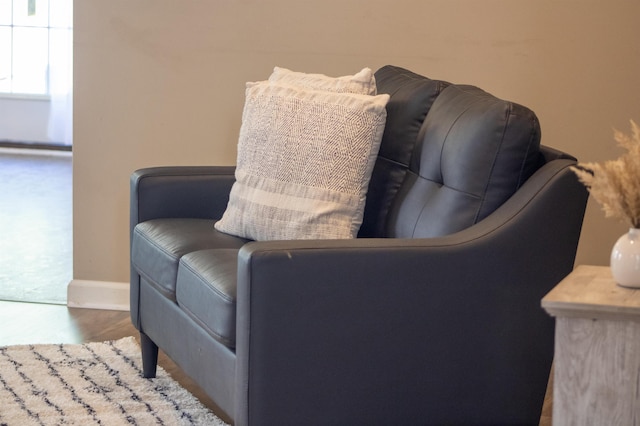 living area featuring baseboards