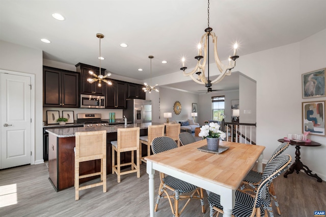 915 Flat Waters Ln, Charlottesville, VA 22911 - dining area featuring a chandelier, light wood finished floors, recessed lighting, and baseboards