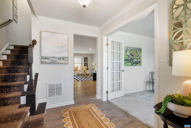 915 Flat Waters Ln, Charlottesville, VA 22911 - foyer entrance with wood finished floors, stairway, crown molding, and baseboards