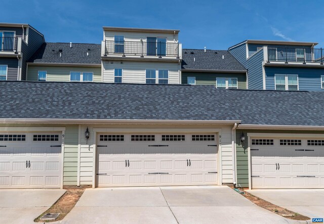 915 Flat Waters Ln, Charlottesville, VA 22911 - view of property with concrete driveway, a shingled roof, and a garage
