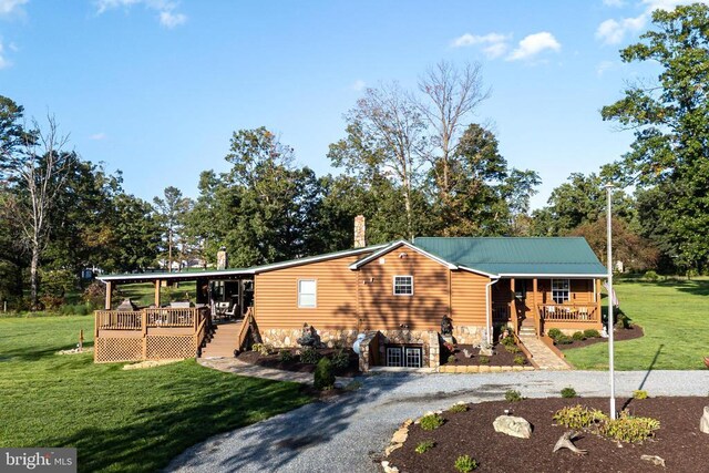 528 Ellis Dr, Luray, VA 22835 - view of front of property with a porch, a front lawn, gravel driveway, stone siding, and a chimney