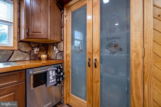 528 Ellis Dr, Luray, VA 22835 - kitchen with decorative backsplash and brown cabinetry