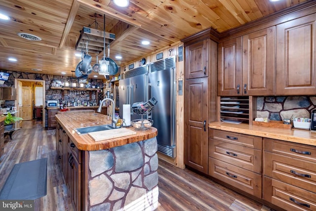 528 Ellis Dr, Luray, VA 22835 - kitchen featuring wooden ceiling, wooden counters, dark wood-style floors, a sink, and an island with sink
