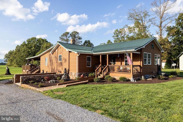 528 Ellis Dr, Luray, VA 22835 - view of front facade featuring a porch, faux log siding, a front lawn, and metal roof