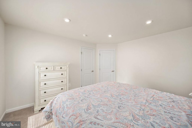 bedroom with light carpet, baseboards, and recessed lighting
