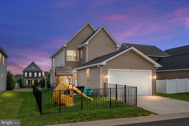 view of front of home featuring a playground, a garage, and driveway